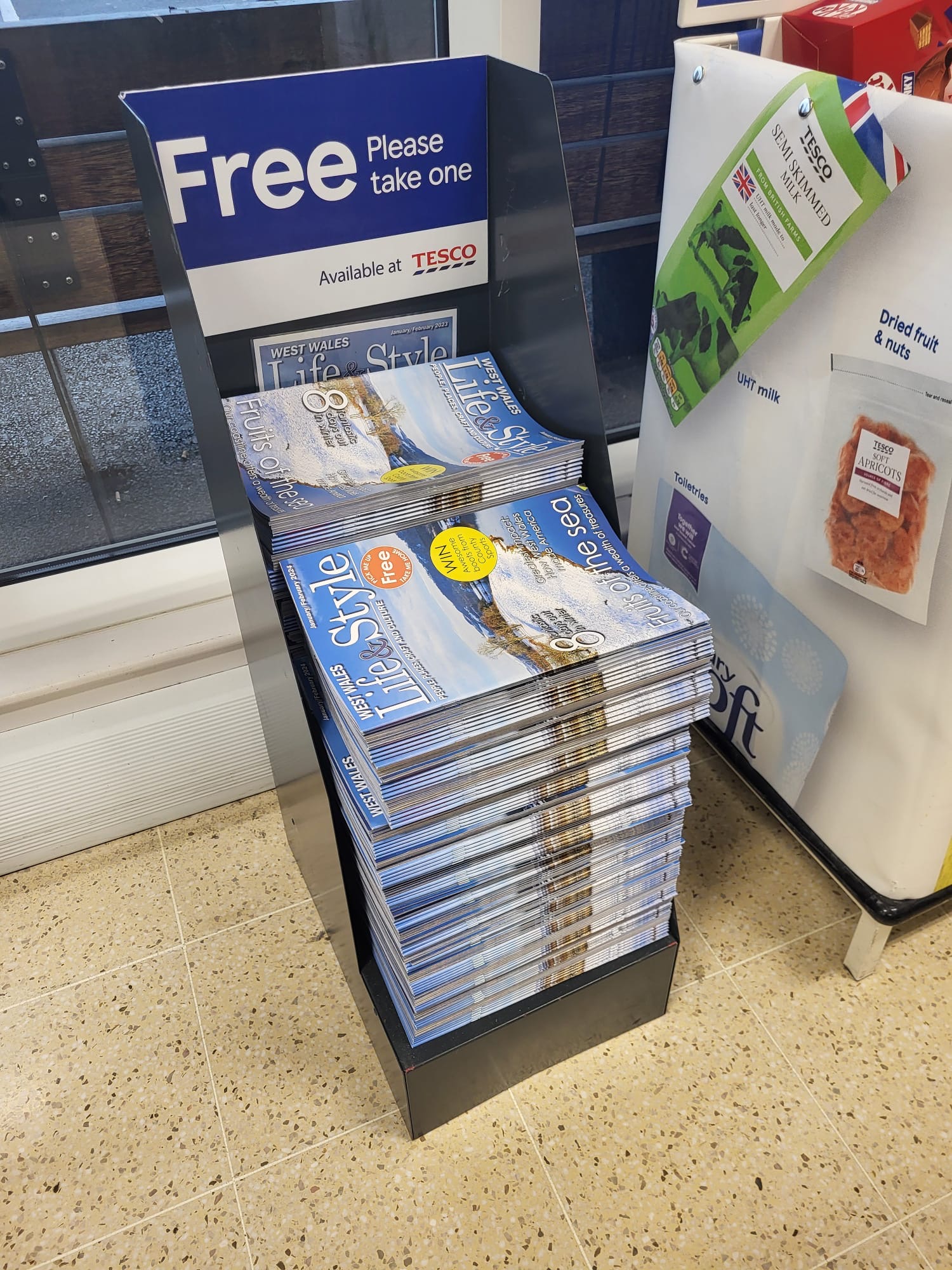 West Wales Life and Style magazines displayed on a dedicated Tesco stand